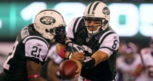 EAST RUTHERFORD, NJ - OCTOBER 11: Quarterback Mark Sanchez #6 of the New York Jets hands the ball off to LaDainian Tomlinson #21 against the Minnesota Vikings at New Meadowlands Stadium on October 11, 2010 in East Rutherford, New Jersey.