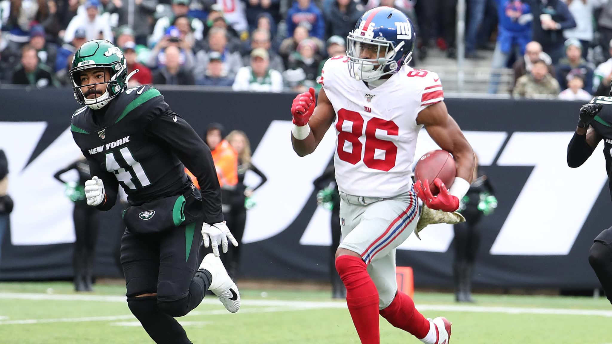 EAST RUTHERFORD, NEW JERSEY - NOVEMBER 10: Darius Slayton #86 of the New York Giants scores his second touchdown in the second quarter against Matthias Farley #41 of the New York Jets during their game at MetLife Stadium on November 10, 2019 in East Rutherford, New Jersey.
