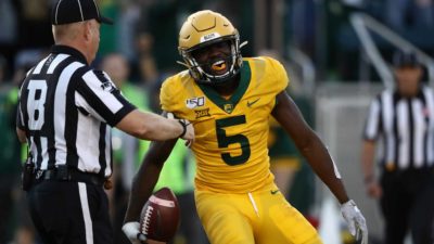 WACO, TEXAS - NOVEMBER 23: Denzel Mims #5 of the Baylor Bears celebrates a touchdown pass reception against the Texas Longhorns in the second half at McLane Stadium on November 23, 2019 in Waco, Texas.