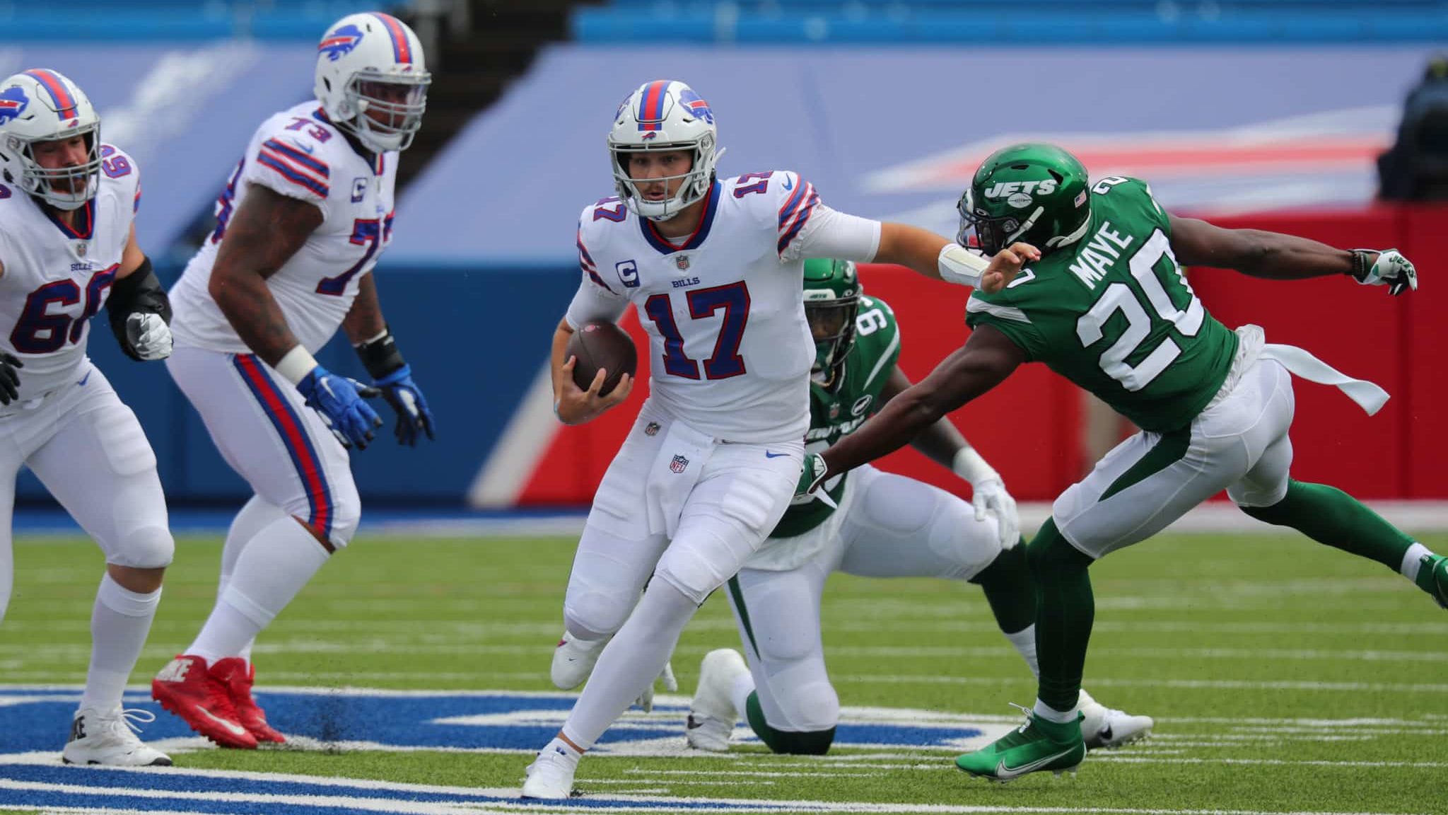 ORCHARD PARK, NY - SEPTEMBER 13: Marcus Maye #20 of the New York Jets tries to make a tackle as Josh Allen #17 of the Buffalo Bills runs the ball during the first quarter at Bills Stadium on September 13, 2020 in Orchard Park, New York.