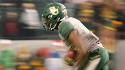 PHOENIX, AZ - DECEMBER 27: Wide receiver Denzel Mims #15 of the Baylor Bears returns a kick off against the Boise State Broncos during the second quarter of the Motel 6 Cactus Bowl at Chase Field on December 27, 2016 in Phoenix, Arizona.