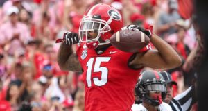 ATHENS, GA - SEPTEMBER 14: Lawrence Cager #15 of the Georgia Bulldogs celebrates a pass reception for a touchdown during the first half of a game against the Arkansas State Red Wolves at Sanford Stadium on September 14, 2019 in Athens, Georgia.