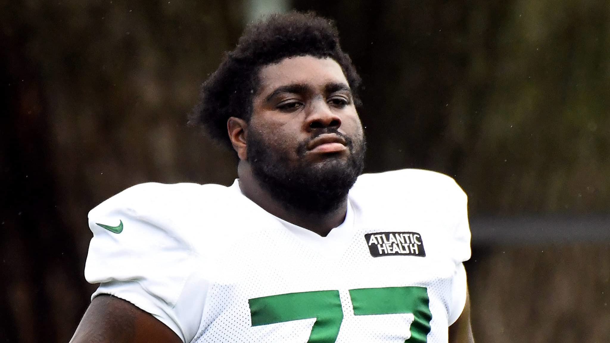 FLORHAM PARK, NEW JERSEY - AUGUST 19: Mekhi Becton #77 of the New York Jets looks on during training camp at Atlantic Health Jets Training Center on August 19, 2020 in Florham Park, New Jersey.