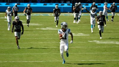 CHARLOTTE, NORTH CAROLINA - SEPTEMBER 13: Robby Anderson #11 of the Carolina Panthers breaks free for a touchdown against the Las Vegas Raiders at Bank of America Stadium on September 13, 2020 in Charlotte, North Carolina. Las Vegas won 34-30.
