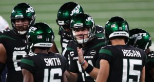 EAST RUTHERFORD, NEW JERSEY - OCTOBER 01: Sam Darnold #14 of the New York Jets huddles the offense against the Denver Broncos during the first quarter at MetLife Stadium on October 01, 2020 in East Rutherford, New Jersey.