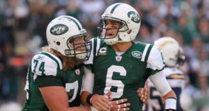 EAST RUTHERFORD, NJ - OCTOBER 23: Mark Sanchez #6 of the New York Jets is congratulated on a touchdown pass by teammate Nick Mangold #74 against the San Diego Chargers at MetLife Stadium on October 23, 2011 in East Rutherford, New Jersey.