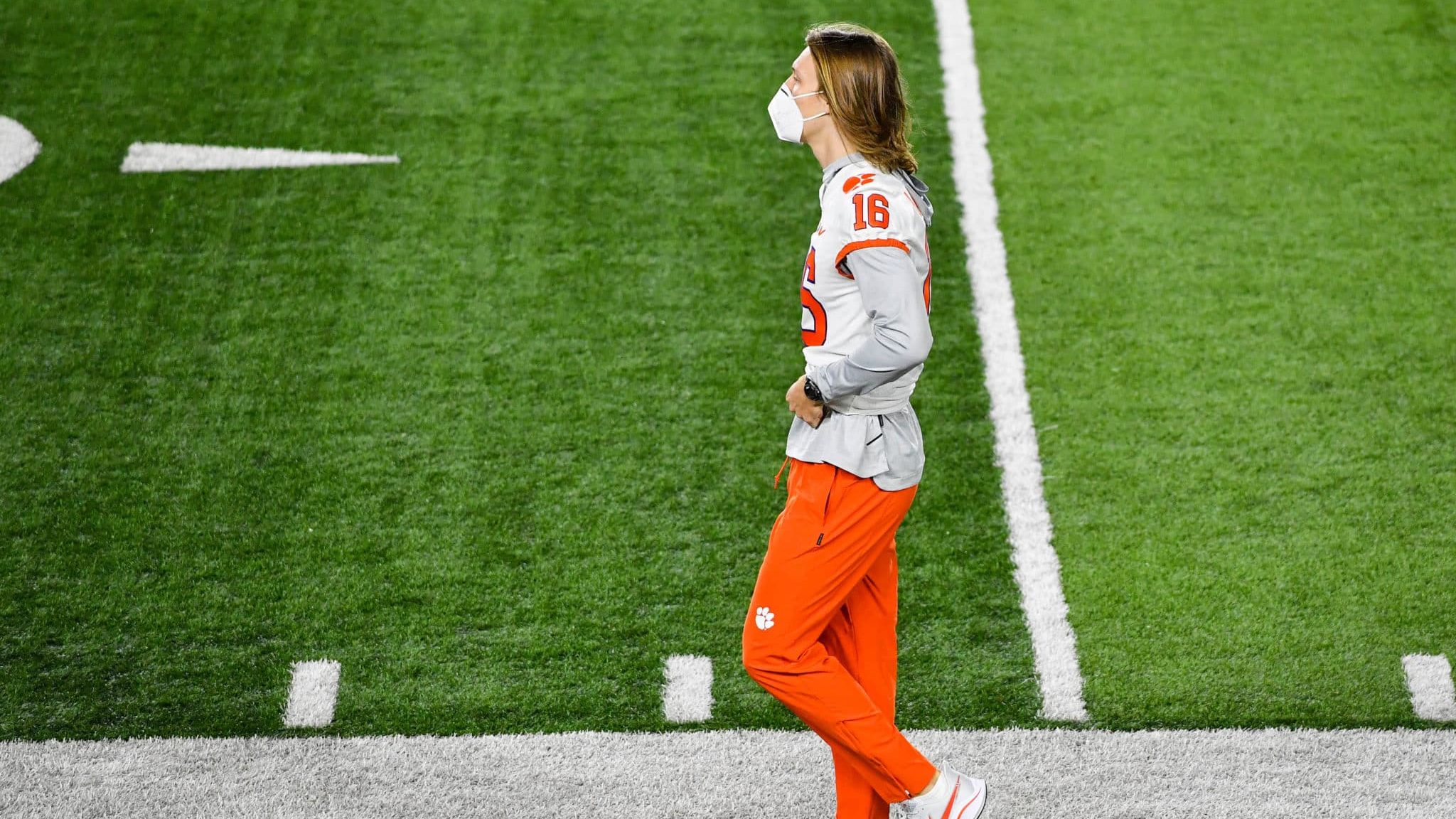 SOUTH BEND, INDIANA - NOVEMBER 07: Quarterback Trevor Lawrence #16 of the Clemson Tigers watches warmups before the game against the Notre Dame Fighting Irish at Notre Dame Stadium on November 7, 2020 in South Bend, Indiana.