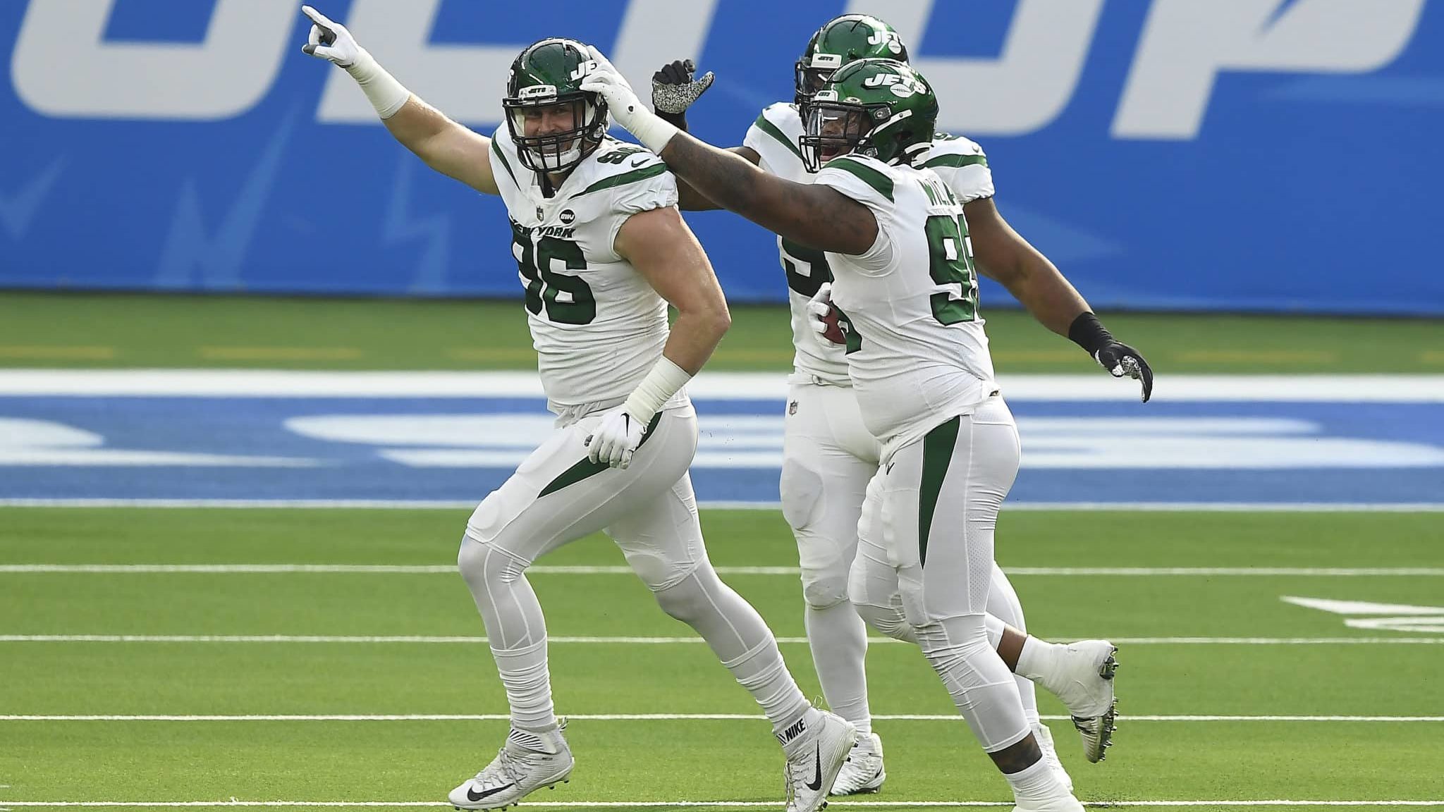 INGLEWOOD, CALIFORNIA - NOVEMBER 22: Henry Anderson #96, Tarell Basham #93, and Quinnen Williams #95 of the New York Jets celebrate after blocking a punt during the first half against the Los Angeles Chargers at SoFi Stadium on November 22, 2020 in Inglewood, California.
