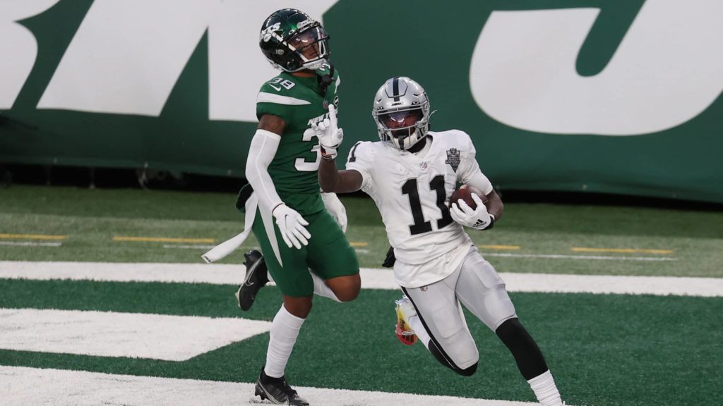 EAST RUTHERFORD, NEW JERSEY - DECEMBER 06: Henry Ruggs III #11 of the Las Vegas Raiders reacts after scoring a touchdown in the final seconds of the second half as Lamar Jackson #38 of the New York Jets looks on at MetLife Stadium on December 06, 2020 in East Rutherford, New Jersey.