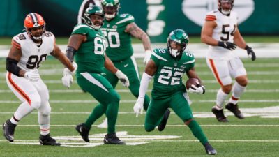 EAST RUTHERFORD, NEW JERSEY - DECEMBER 27: La'Mical Perine #22 of the New York Jets carries the ball for a first down in the third quarter against the Cleveland Browns at MetLife Stadium on December 27, 2020 in East Rutherford, New Jersey. (