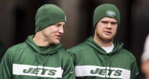 ORCHARD PARK, NY - DECEMBER 09: Josh McCown #15 (left) and Sam Darnold #14 of the New York Jets speak as they walk out for warm ups before the game against the Buffalo Bills at New Era Field on December 9, 2018 in Orchard Park, New York.