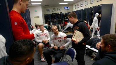 SEATTLE, WA - DECEMBER 29: Pass Game Coordinator Mike LaFleur and George Kittle #85 of the San Francisco 49ers talk in the locker room prior to the game against the Seattle Seahawks at CenturyLink Field on December 29, 2019 in Seattle, Washington. The 49ers defeated the Seahawks 26-21.