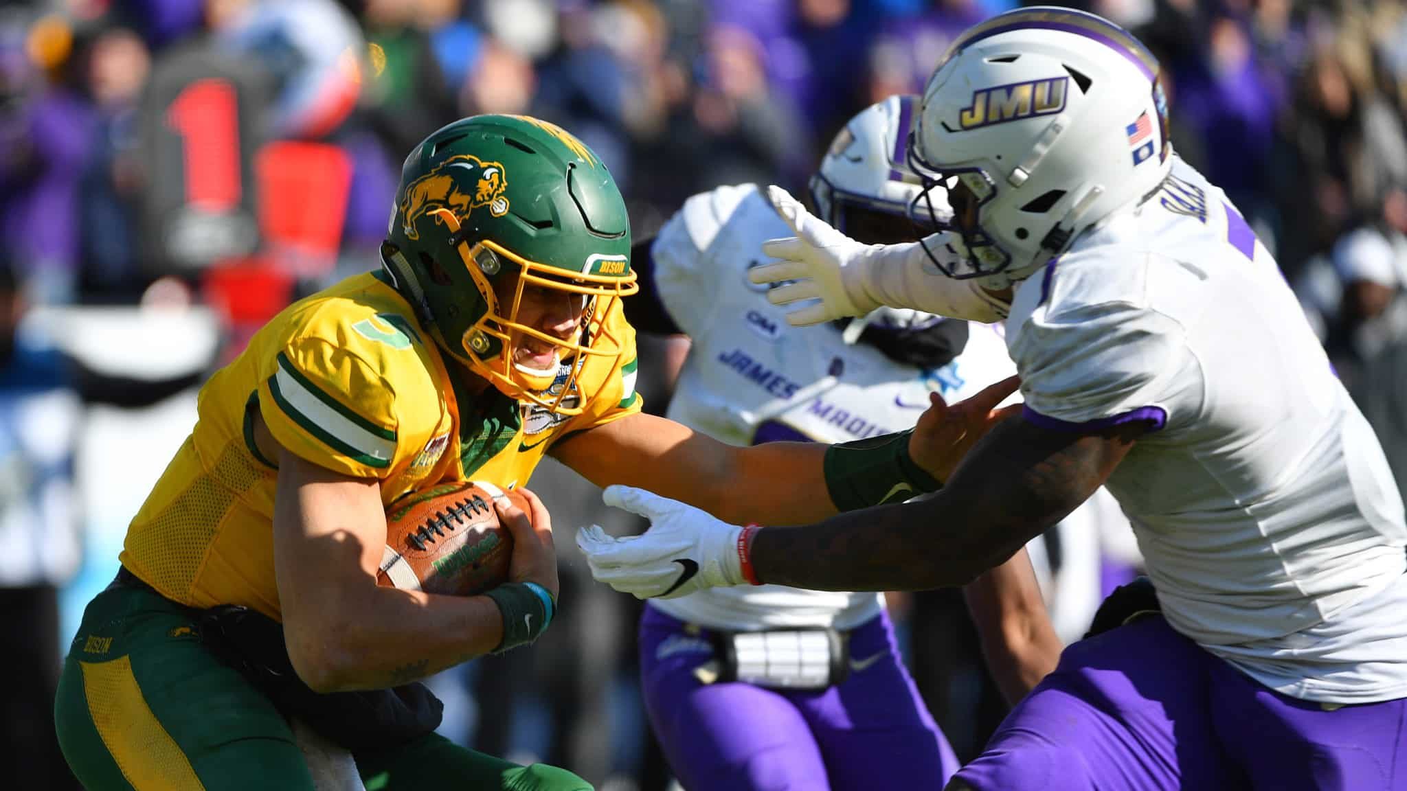 FRISCO, TX - JANUARY 11: John Daka #7 of the James Madison Dukes tackles Trey Lance #5 of the North Dakota State Bison during the Division I FCS Football Championship held at Toyota Stadium on January 11, 2020 in Frisco, Texas.