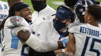 MINNEAPOLIS, MN - SEPTEMBER 27: Derrick Henry #22 of the Tennessee Titans celebrates with offensive coordinator Arthur Smith at the end of the game agains the Minnesota Vikings at U.S. Bank Stadium on September 27, 2020 in Minneapolis, Minnesota. The Titans defeated the Vikings 31-30.