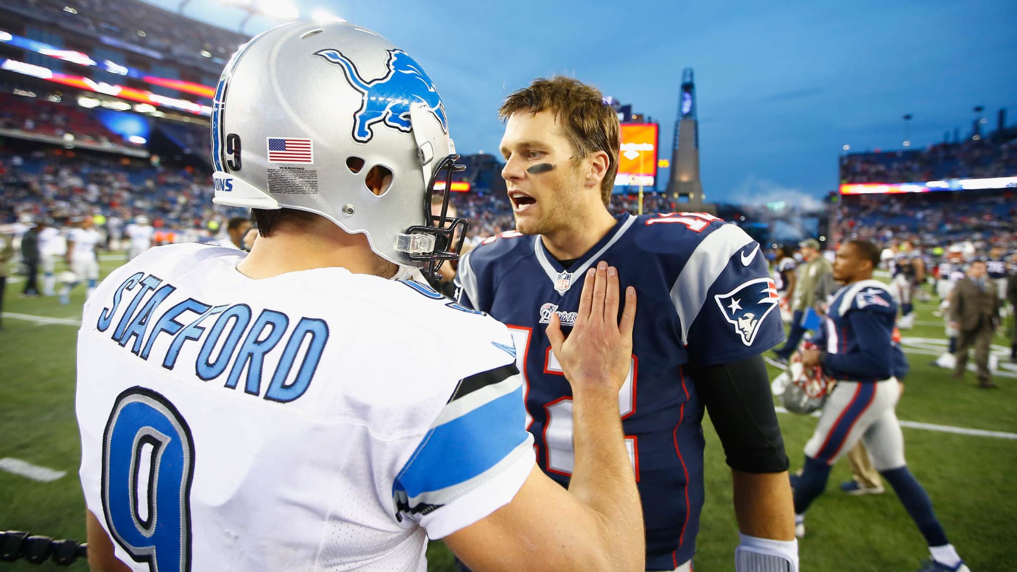 FOXBORO, MA - NOVEMBER 23: Tom Brady #12 of the New England Patriots shakes hands with Matthew Stafford #9 of the Detroit Lions after a game at Gillette Stadium on November 23, 2014 in Foxboro, Massachusetts.