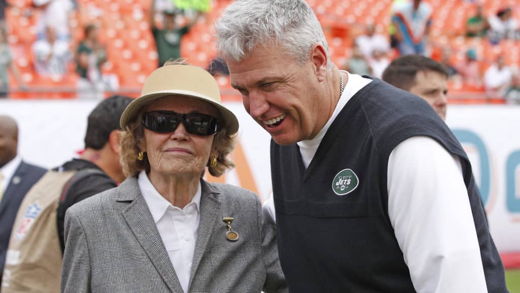 MIAMI GARDENS, FL - DECEMBER 29: Head coach Rex Ryan of the New York Jets talks to Betty Wold Johnson, mother of New York Jets owner Woody Johnson prior to the game against the Miami Dolphins on December 29, 2013 at Sun Life Stadium in Miami Gardens, Florida. The Jets defeated the Dolphins 20-7.