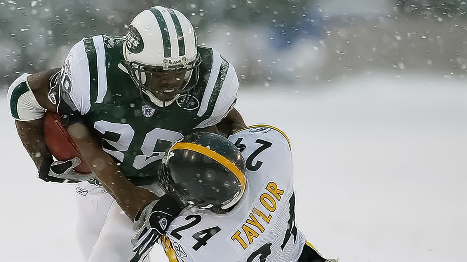 UNITED STATES - DECEMBER 14: The New York Jets' Curtis Martin tries to break free of a tackle by the Pittsburgh Steelers' Ike Taylor on a snowy field in the first half at Giants Stadium. The Jets triumphed, 6-0, on two field goals.
