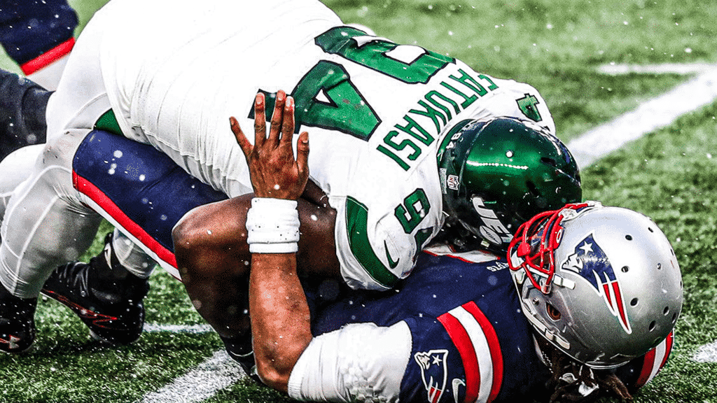 FOXBOROUGH, MA - JANUARY 03: Foley Fatukasi #94 of the New York Jets is called for roughing the passer after tackling Cam Newton #1 of the New England Patriots during a game at Gillette Stadium on January 3, 2021 in Foxborough, Massachusetts.