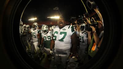 MIAMI - SEPTEMBER 26: Tackle Damein Woody #67 of the New York Jets fires up the team against the Miami Dolphins on September 26, 2010 in Miami, Florida. Jets beat the Dolphins 31-23.