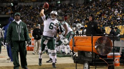PITTSBURGH, PA - JANUARY 23: Quarterback Mark Sanchez #6 of the New York Jets warms up his arm on the sideline against the Pittsburgh Steelers during the 2011 AFC Championship game at Heinz Field on January 23, 2011 in Pittsburgh, Pennsylvania. The Steelers won 24-19.