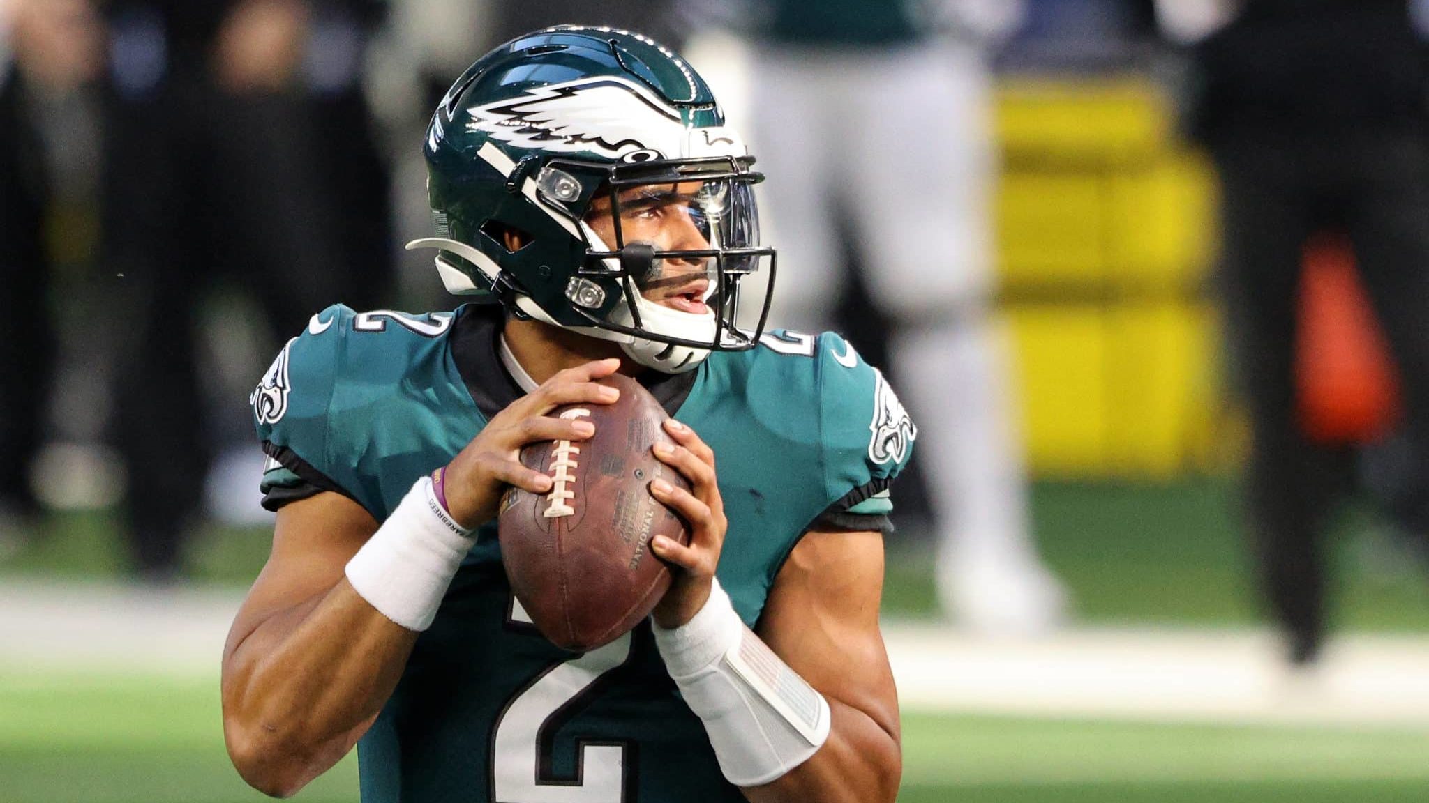 ARLINGTON, TEXAS - DECEMBER 27: Jalen Hurts #2 of the Philadelphia Eagles looks to pass in the first quarter against the Dallas Cowboys at AT&T Stadium on December 27, 2020 in Arlington, Texas.