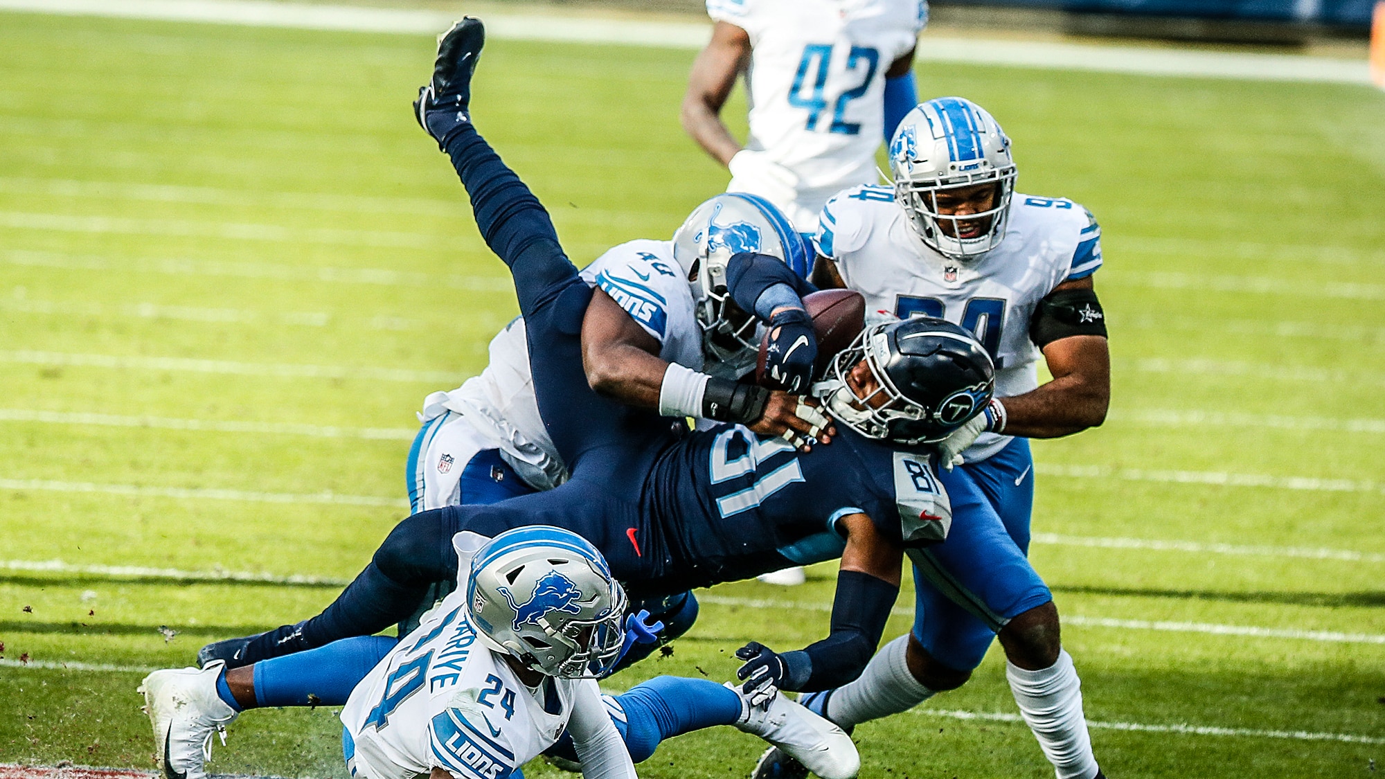 NASHVILLE, TENNESSEE - DECEMBER 20: Jonnu Smith #81 of the Tennessee Titans is tackled by the Detroit Lions at Nissan Stadium on December 20, 2020 in Nashville, Tennessee.