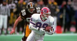 PITTSBURGH, PA - JANUARY 6: Punt returner Steve Tasker #89 of the Buffalo Bills is pursued by linebacker Jerry Olsavsky #55 of the Pittsburgh Steelers as he runs with the football during a playoff game at Three Rivers Stadium on January 6, 1996 in Pittsburgh, Pennsylvania. The Steelers defeated the Bills 40-21.