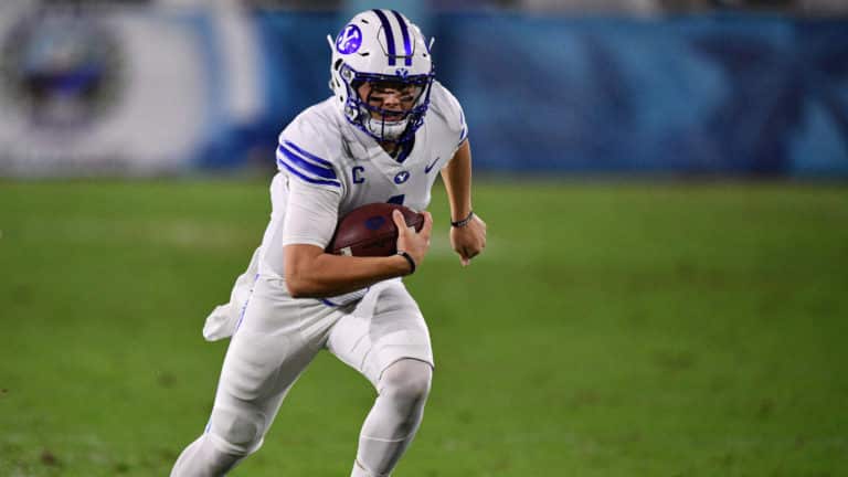 BOCA RATON, FLORIDA - DECEMBER 22: Zach Wilson #1 of the Brigham Young Cougars runs for a touchdown in the first half against the Central Florida Knights at FAU Stadium on December 22, 2020 in Boca Raton, Florida.