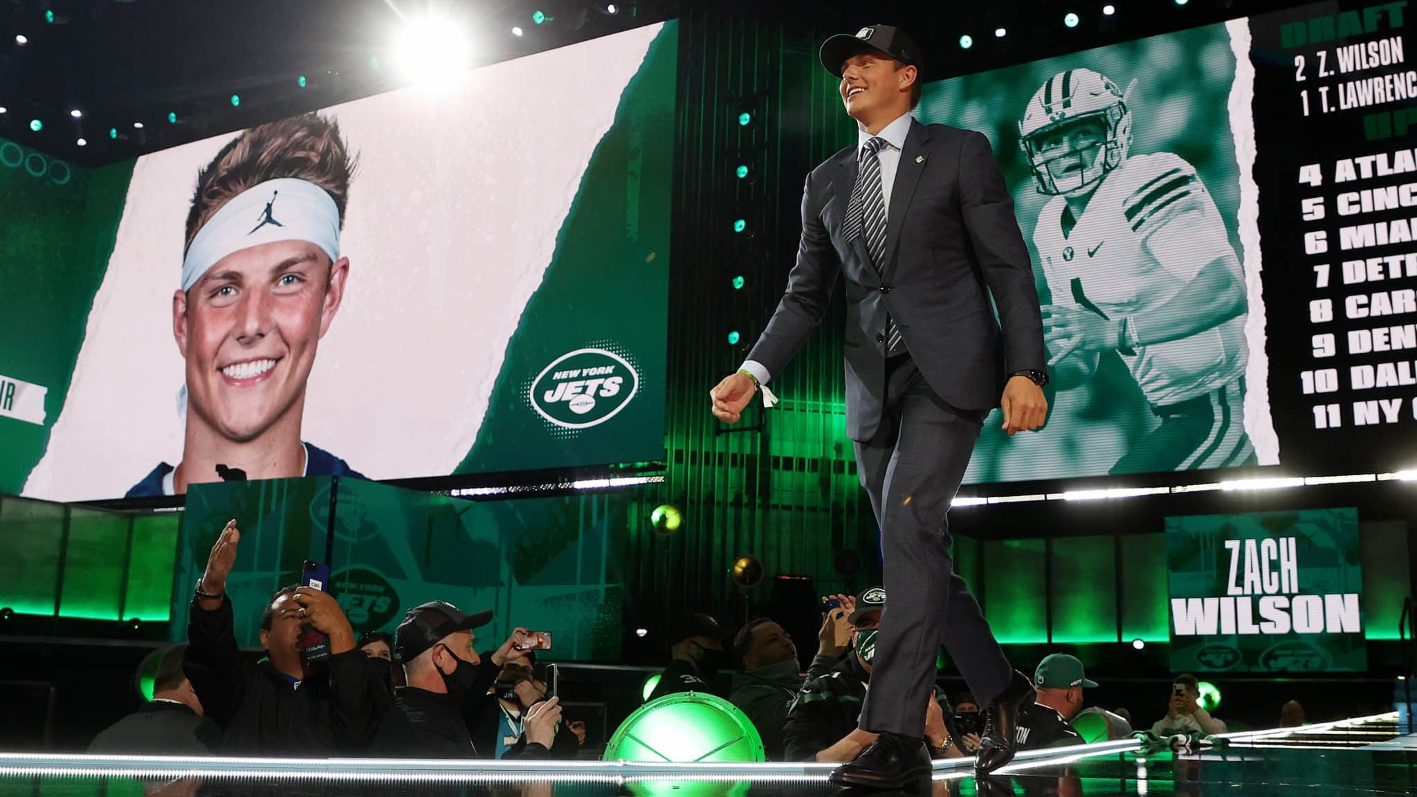 CLEVELAND, OHIO - APRIL 29: Zach Wilson walks onstage after being drafted second by the New York Jets during round one of the 2021 NFL Draft at the Great Lakes Science Center on April 29, 2021 in Cleveland, Ohio.