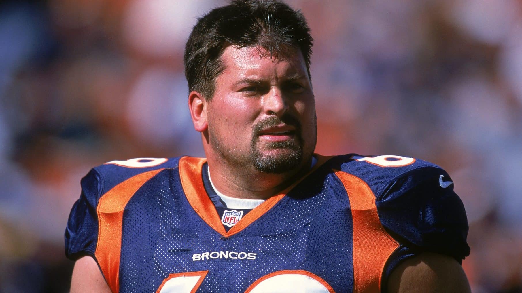 15 Oct 2000: Mark Schlereth #69 of the Denver Broncos looks on the field during the game against the Cleveland Browns at the Mile High Stadium in Denver, Colorado. The Broncos defeated the Browns 44-10.