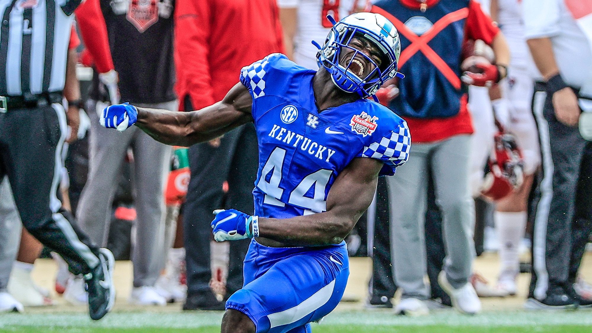 JACKSONVILLE, FLORIDA - JANUARY 02: Jamin Davis #44 of the Kentucky Wildcats celebrates a defensive stop against the North Carolina State Wolfpack during the TaxSlayer Gator Bowl at TIAA Bank Field on January 02, 2021 in Jacksonville, Florida.