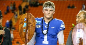 HONOLULU, HI - DECEMBER 24: Zach Wilson #1 of the BYU Cougars holds the MVP trophy at the Hawai'i Bowl at Aloha Stadium on December 24, 2019 in Honolulu, Hawaii.