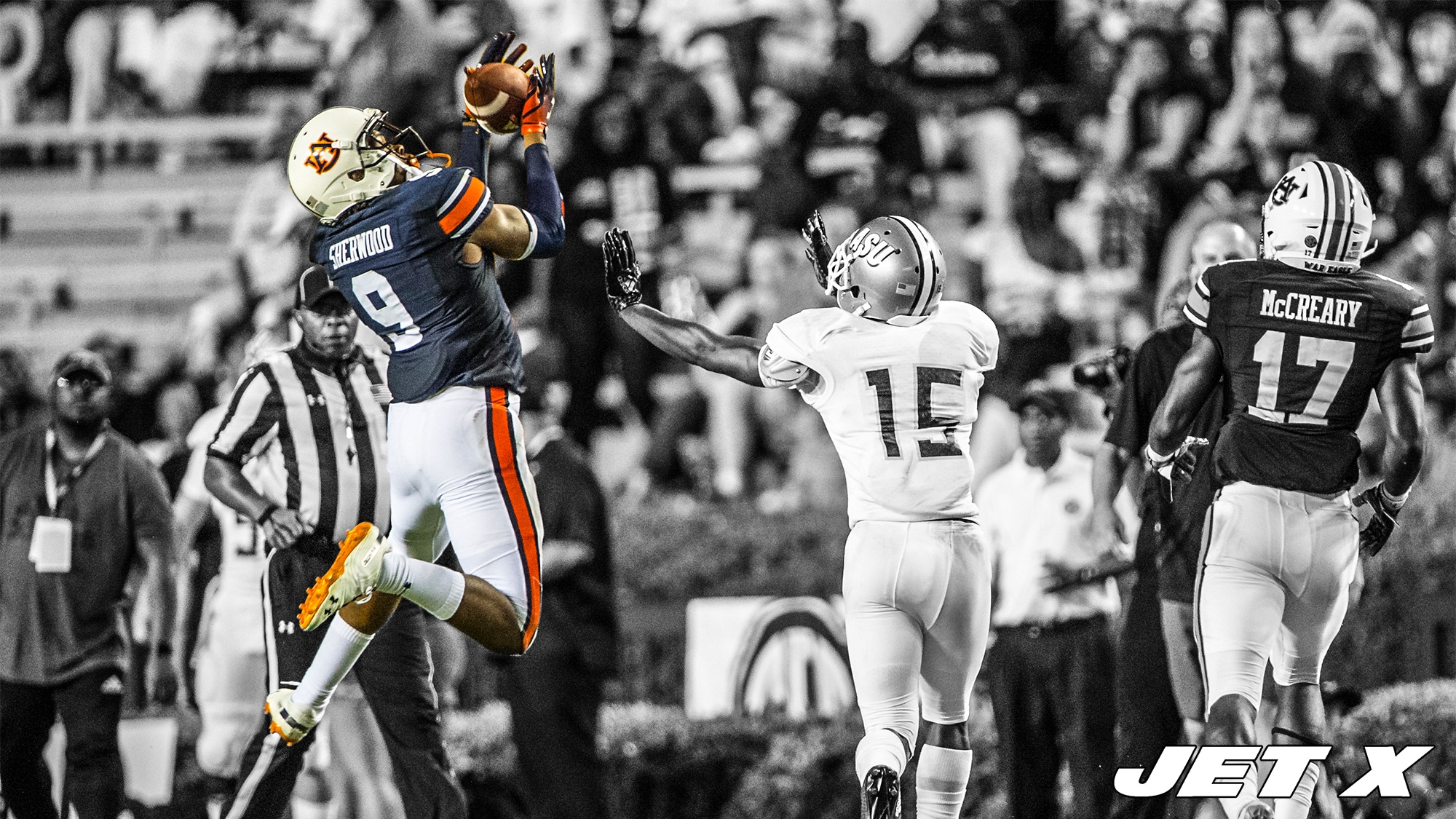 AUBURN, AL - SEPTEMBER 8: Defensive back Jamien Sherwood #9 of the Auburn Tigers intercepts a pass intended for wide receiver Joe Williams IV #15 of the Alabama State Hornets during the fourth quarter at Jordan-Hare Stadium on September 8, 2018 in Auburn, Alabama.