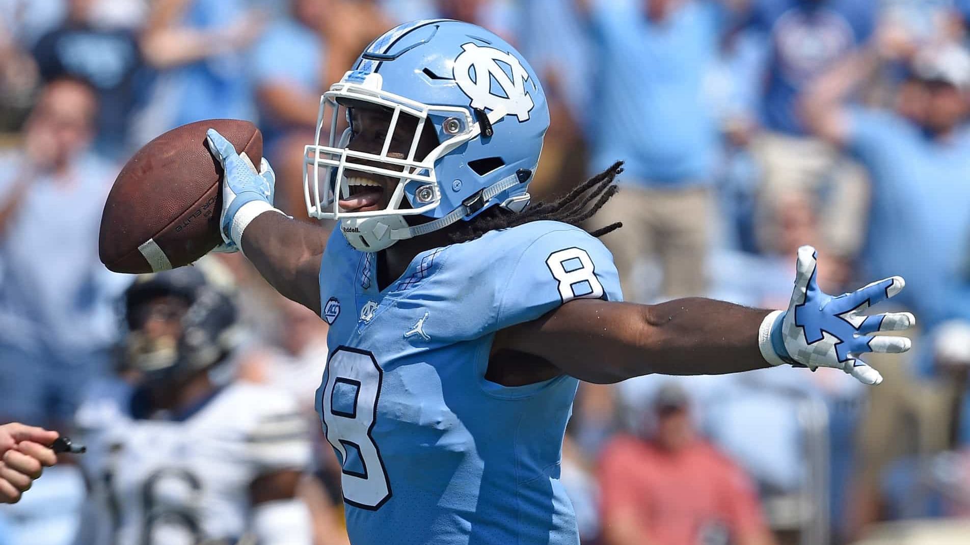 CHAPEL HILL, NC - SEPTEMBER 22: Michael Carter #8 of the North Carolina Tar Heels reacts after scoring a touchdown against the Pittsburgh Panthers during their game at Kenan Stadium on September 22, 2018 in Chapel Hill, North Carolina.