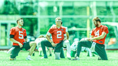 FLORHAM PARK, NEW JERSEY - JUNE 15: (L-R) Mike White #5, Zach Wilson #2 and James Morgan #4 of the New York Jets look on during New York Jets Mandatory Minicamp on June 15, 2021 at Atlantic Health Jets Training Center in Florham Park, New Jersey.