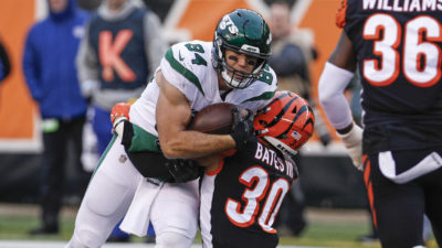 CINCINNATI, OH - DECEMBER 01: Ryan Griffin #84 of the New York Jets is tackled by Jessie Bates #30 of the Cincinnati Bengals during the second half at Paul Brown Stadium on December 1, 2019 in Cincinnati, Ohio.