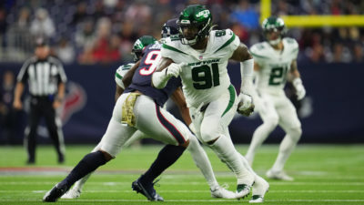 HOUSTON, TEXAS - NOVEMBER 28: John Franklin-Myers #91 of the New York Jets defends against the Houston Texans during an NFL game at NRG Stadium on November 28, 2021 in Houston, Texas.