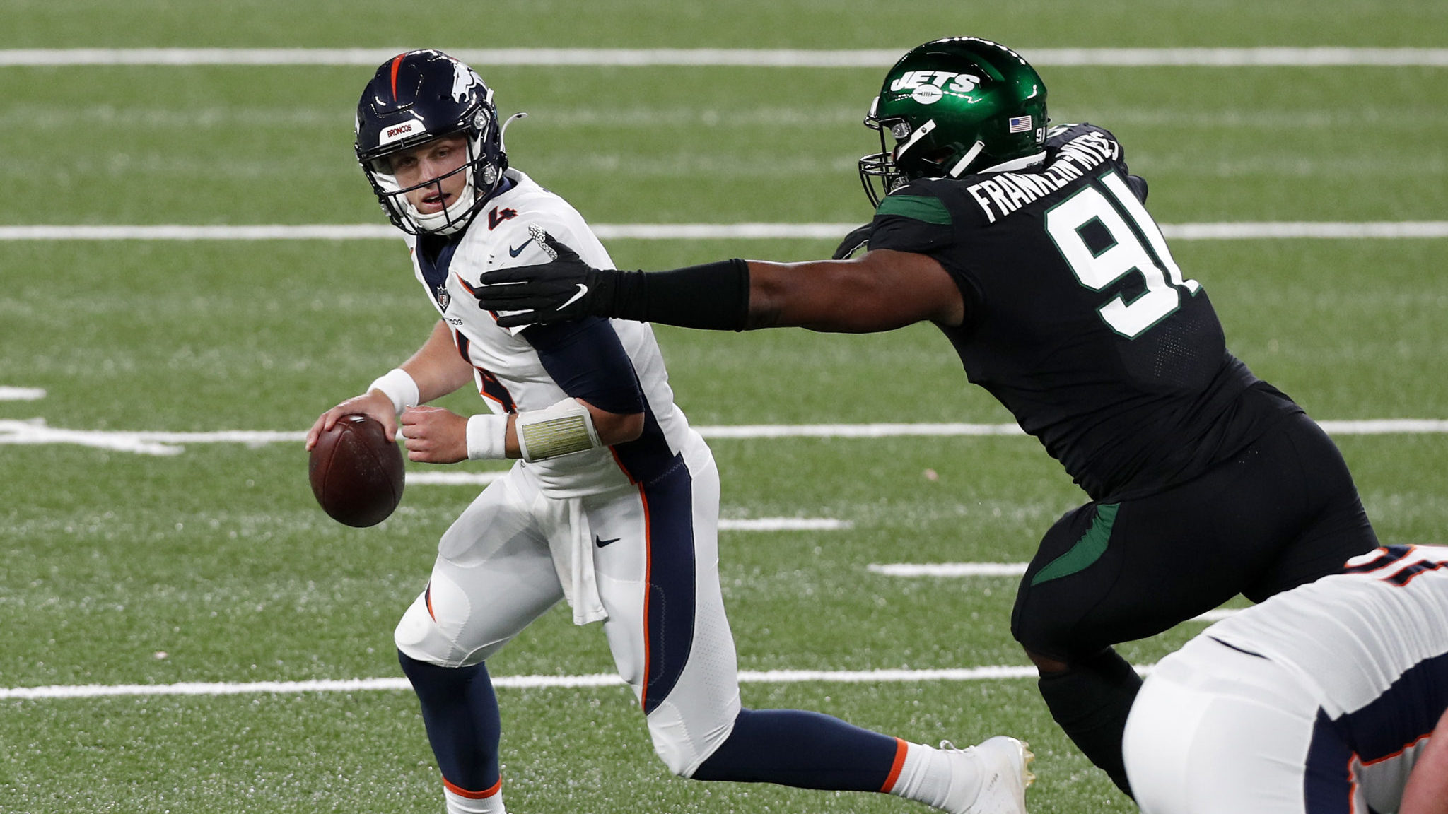 EAST RUTHERFORD, NEW JERSEY - OCTOBER 01: (NEW YORK DAILIES OUT) Brett Rypien #4 of the Denver Broncos in action against John Franklin-Myers #91 of the New York Jets at MetLife Stadium on October 01, 2020 in East Rutherford, New Jersey. The Broncos defeated the Jets 37-28.